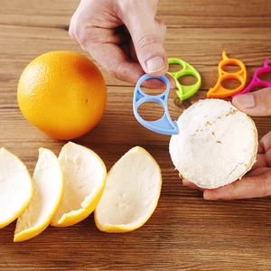 Bird-shaped plastic orange peeler tool set with finger rings in multiple vibrant colors