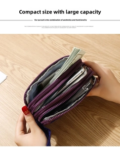Detailed interior of purple nylon wallet showing three zipper layers holding phone and cash