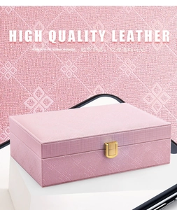Detail of premium pink PU leather texture and gold metal buckle on jewelry box