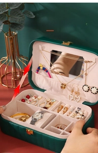Deep green leather jewelry box with multi-layer storage, mirror and ring slots