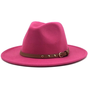 Detail of magenta wool fedora hat with brown leather belt and gold rivet accents