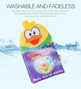 Washable duck hand puppet cloth book showing waterproof feature with water splashes