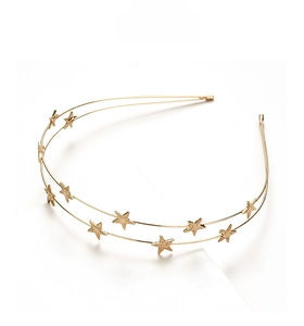 Detail of a golden double-layered metal headband featuring elegant five-pointed stars