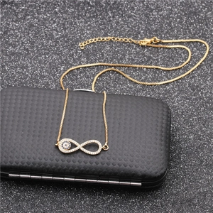 Infinity eye necklace with blue crystals and cubic zirconia in a gold-plated finish