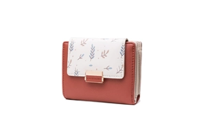 Detailed view of women's short PU leather wallet with leaf print and metal logo buckle