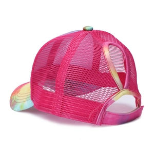 Detail of rose red mesh ponytail baseball cap featuring colorful tie-dye patterns and velcro