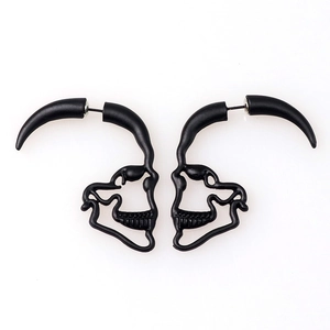 Unique matte black hollow skull stud earrings in a minimalist punk rock style