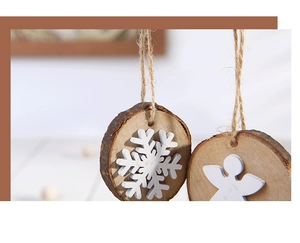 Macro view of natural wood Christmas ornaments with snowflake and angel cutouts