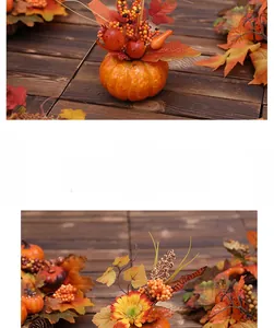 Detail of faux pumpkins with maple leaves and berries for autumn Halloween decor