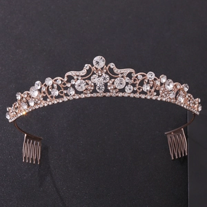 Detail of rose gold bridal tiara featuring sparkling rhinestones and side hair combs