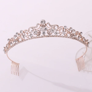 Detailed view of rose gold bridal crown with crystals and secure hair comb fixings