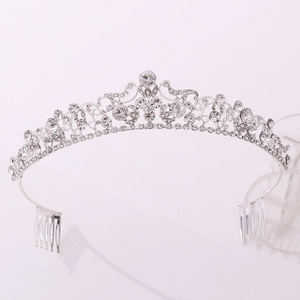 Luxurious silver bridal crown with intricate crystal scrollwork and secure side hair combs