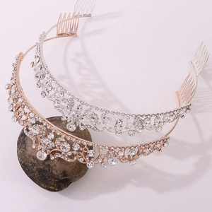 Close-up of luxury bridal hair combs with glittering rhinestones in gold and silver finish