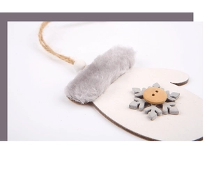 Detail of white wooden glove ornament with gray faux fur cuff and felt snowflake decor
