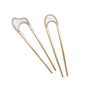 Minimalist gold U-shaped hair pins with white mother-of-pearl inlay for bun hairstyles