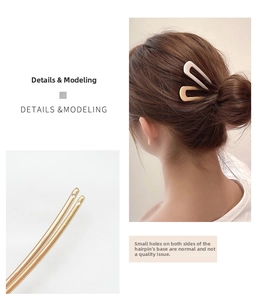 Detailed view of U-shaped metal hairpins in gold and cream white for elegant styling