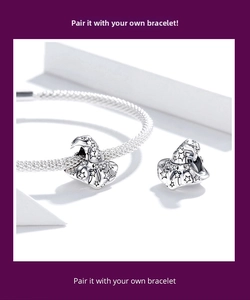 Macro detail of S925 silver magic hat charm with star patterns and zircon on a bracelet