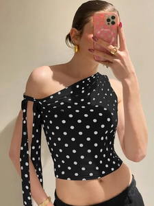 Polka dot one shoulder top with a bow tie detail and slim fit cropped design for women