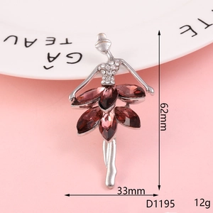 Silver ballet dancer brooch with purple gemstones and dimensions 62mm by 33mm