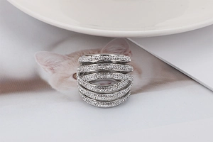 Close-up of silver multilayered wrap ring with full pavé white cubic zirconia stones