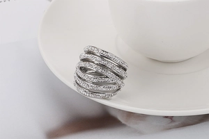 Macro shot of silver multilayer cross wrap ring with sparkling pavé cubic zirconia