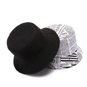 Fashionable canvas bucket hats in solid black and newspaper print styles for chic women