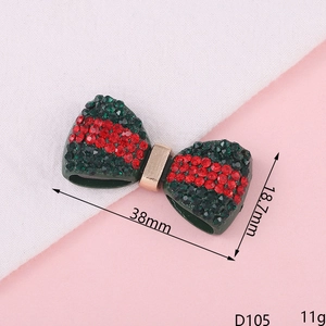 Detail showing 38x18.7mm green and red rhinestone bow charm for DIY crafts