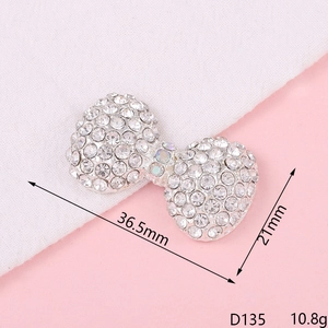 Sparkling rhinestone bow pendant detail showing 36.5x21mm dimensions and D135 model code