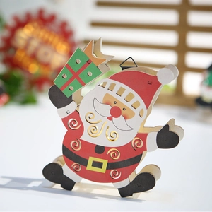 Illuminated wooden Santa Claus ornament holding gift box for Christmas tree decor