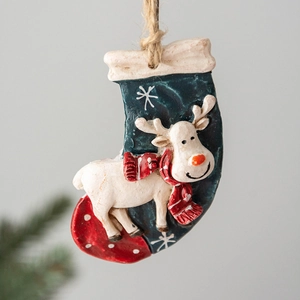 Vintage Christmas resin reindeer pendant on a red stocking for festive tree decoration