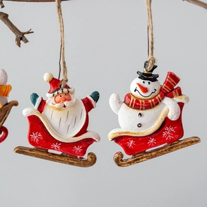 Christmas resin santa and snowman sled ornaments with ropes for festive tree decoration