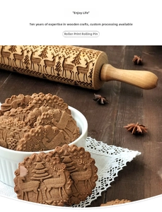 Macro detail of wooden rolling pin with engraved reindeer and Christmas tree patterns