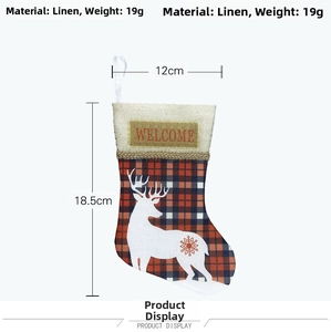 Detailed view of linen Christmas stocking with white reindeer print and red plaid pattern