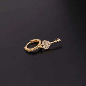 Gold hoop earring featuring a heart pendant and key charm with sparkling zircon accents