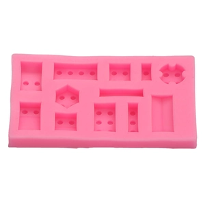 Pink silicone mold for building block shapes including squares and hexagons for baking