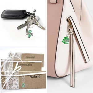 Green pearl angel wing charm used as keychain, bag accessory, and gift decoration