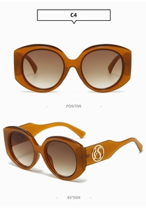 Front and 45-degree side views of amber brown round frame sunglasses with gold temple logo