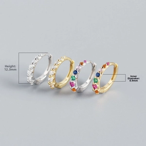 Detail view of 12.3mm S925 sterling silver huggie earrings with rainbow zircon stones