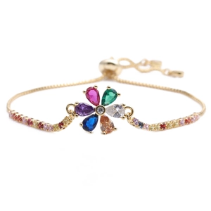 Adjustable gold chain bracelet with colorful crystal flower charms and a sliding clasp