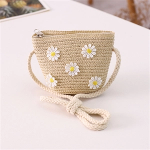 Detail of handmade straw crossbody bag for girls featuring five white daisy embroidery