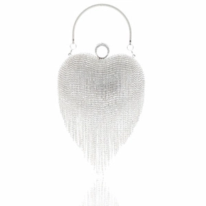 Detailed view of heart-shaped evening bag with crystal tassels and silver round metal handle