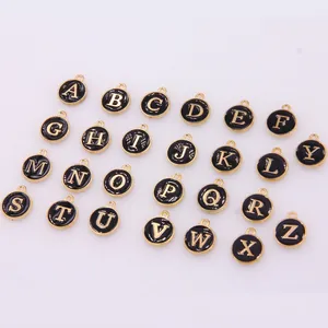 26-piece set of gold-trimmed black enamel alphabet charms for DIY jewelry making