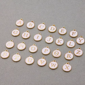 Set of 26 gold-plated round alphabet charms with white enamel for DIY jewelry making