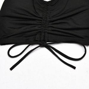 Close-up of black ruched fabric detailing with adjustable drawstring on women's set