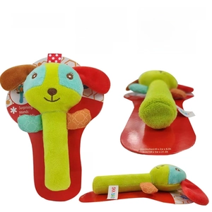 Detail of green puppy plush rattle with soft fabric texture and built-in BB squeaker