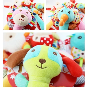 Detail of plush animal rattle toys featuring lion and elephant designs for infants