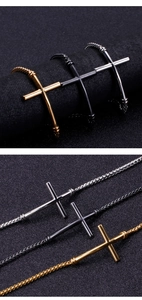 Detailed view of woven cross bracelets in gold, black, and silver stainless steel