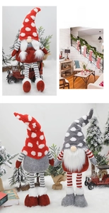 Macro detail of Christmas Swedish Tomte gnomes with long striped legs and knitted hats