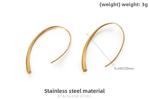 Detail view of gold stainless steel linear C-shape earrings with 44x25mm dimensions