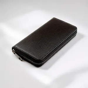 Detail of the black leather wallet featuring a straw mat texture and gunmetal zipper